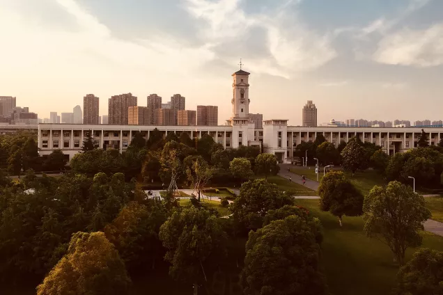 Buildings and a park in sunset. Photo.