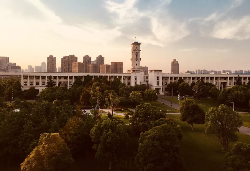 Buildings and a park in sunset. Photo.